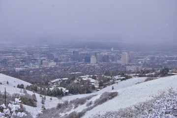 Obraz premium Little Black Mountain Peak hiking trail snow views winter via Bonneville Shoreline Trail, Wasatch Front Rocky Mountains, by Salt Lake City, Utah. United States.