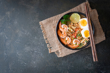 instant noodles ramen in spicy soup with shrimps (Tom Yum Kung) - Asian food style. Pasta, Noodles, junk food concept