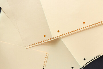 detail of overlapping coil or spiral notebook craft paper pockets unfolded - photographed from above
