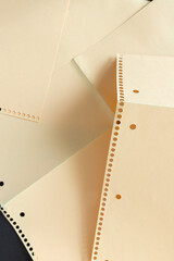 detail of overlapping coil or spiral notebook craft paper pockets unfolded - photographed from above