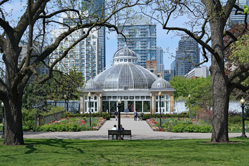 A large old greenhouse in a public park in downtown Toronto