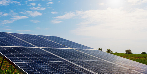 solar cell panel with blue sky and sunset. energy cleaning in nature concept