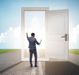 Businessman in front of door in business opportunities concept