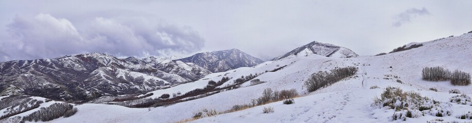 Fototapeta na wymiar Little Black Mountain Peak hiking trail snow views winter via Bonneville Shoreline Trail, Wasatch Front Rocky Mountains, by Salt Lake City, Utah. United States.