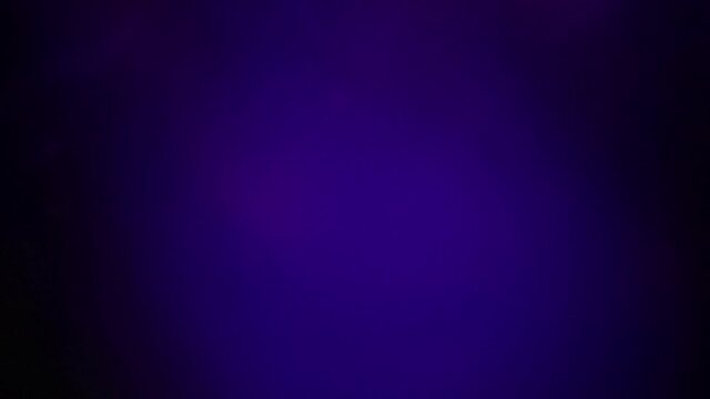 Beautiful bokeh lights slowly moving around for background or wallpaper in purple color. aesthetic smooth screen saver