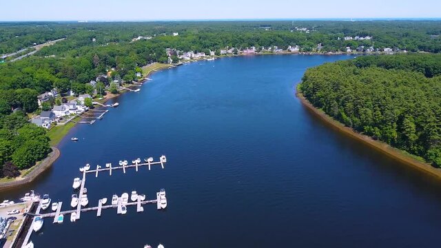 Merrimack River aerial view in summer between city of Amesbury and Newburyport near river mouth to Atlantic, Massachusetts MA, USA. 