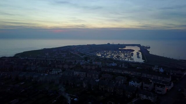 Troon Town Centre and Port at Dusk Time, Aerial Dolly Forward,