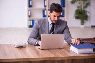 Young businessman employee working in the office