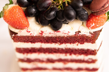 Close-up on Red velvet cake. Slice of cake. Raspberry cake. Devil's cake. Wedding dessert. Birthday party. Delicious dessert. Traditional american dessert