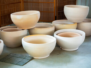 Various colorful plant pots in the shop.