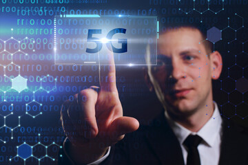 Business, Technology, Internet and network concept. Young businessman working on a virtual screen of the future and sees the inscription: 5G