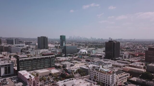 LA: Drone shot over Hollywood looking out towards the Downtown Skyline on a bright clear day