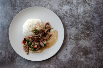 Asian food Most popular, Thai food style, Stir fry Basil Beef (PAD GRA PROW) with Jasmine rice with copy space on background