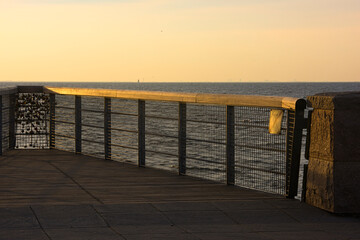 Fototapeta na wymiar 210501 Malmo Sweden - Sunset over pier of love locks. High quality photo