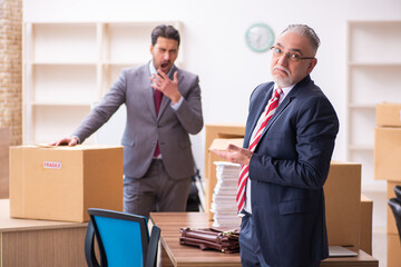 Fototapeta na wymiar Two male employees in relocation concept