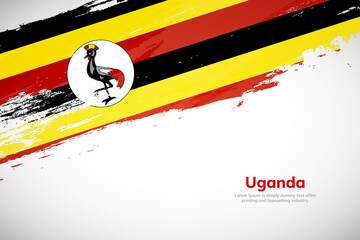 Brush painted grunge flag of Uganda country. Hand drawn flag style of Uganda. Creative brush stroke concept background