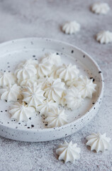 Small white meringues in the  ceramic bowl