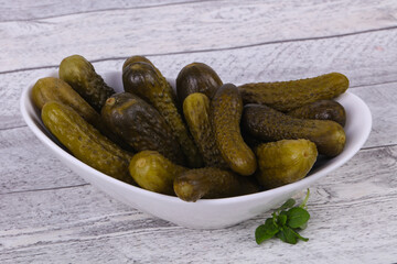 Pickled cucumbers heap in the bowl