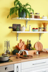 Cooking utensils and products on table in modern kitchen