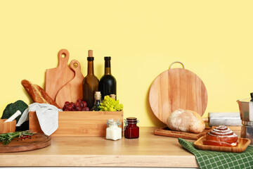 Cooking utensils and products on kitchen table