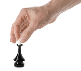 Male hand with chess piece on white background