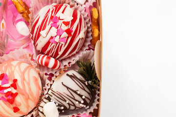 Strawberries wrapped in chocolate, decorated as a gift.