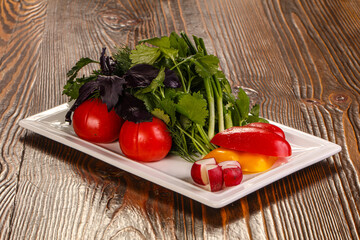 Fresh vegetables plate with vegetables and herbs
