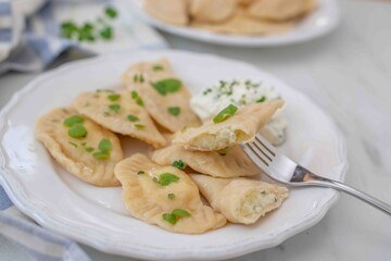 Pierogi ruskie, Baked dumplings stuffed with curd cheese and potatoes