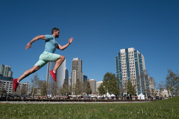 Fototapeta na wymiar Active man runner jogging outdoor near city.