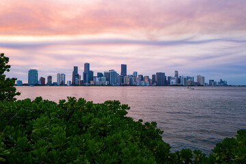 Miami, Florida, USA skyline on Biscayne Bay, city night backgrounds. Panoramic view of Miami at sunset, night downtown.