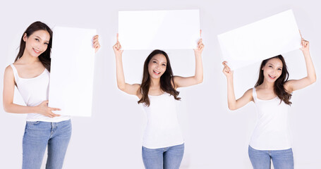 Asian woman show white board isolated on gray background