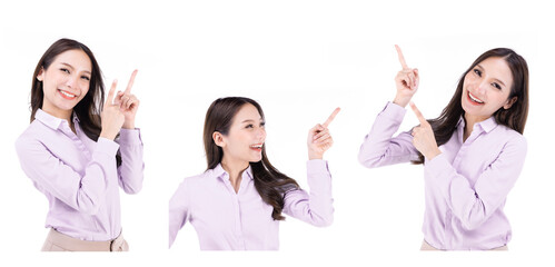 Asian young beautiful female hold hands up and finger point and look up smiling on white background.