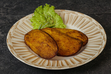Baked potato with herbs and spices