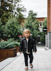 child in leather black jacket 