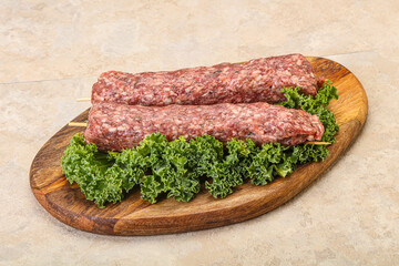 Raw minced beef kebab skewer