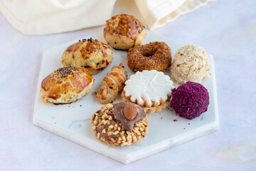 Different kinds of sweet cookies on a white background