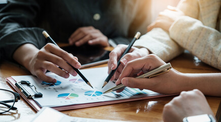 Group of business people discuss current financial and economic paperwork for investment at the meeting. Analytics intelligence concept.