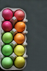 Fototapeta na wymiar Colored Easter eggs on a gray background