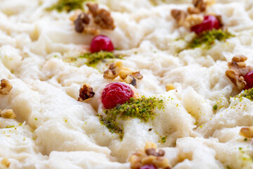 Close-up hazelnut gullac dessert. Traditional Ramadan dessert. Middle Eastern desserts. Local name güllaç dessert