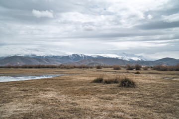 Moody panoramic view of landscapes with marshes and lakes inside Sultan Reedy (Sultansazligi) National Park, Central Anatolia, Turkey