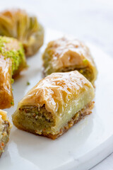 Mixed baklava plate on marble plate. Close up baklava