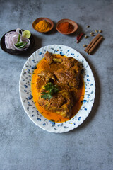 Top view of popular mughal cuisine chicken chap in a serving plate with use of selective focus.