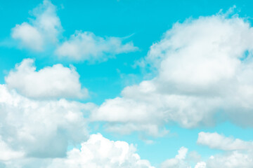 Vibrant blue sky and white clouds background, vivid colors