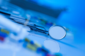 Dentist equipment on blue background