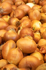 fresh onions at the market. Bulk onions. ripe onions in a street market