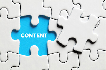 Fototapeta premium The word content on a missing puzzle piece. Online website content