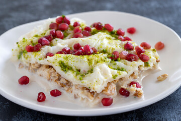 Gullac dessert on dark background. The traditional Ramadan dessert gullac. Milk dessert.