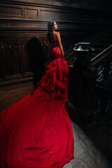 Fototapeta na wymiar Woman Vintage Red Dress Old Castle Beautiful Princess In Seductive Dress