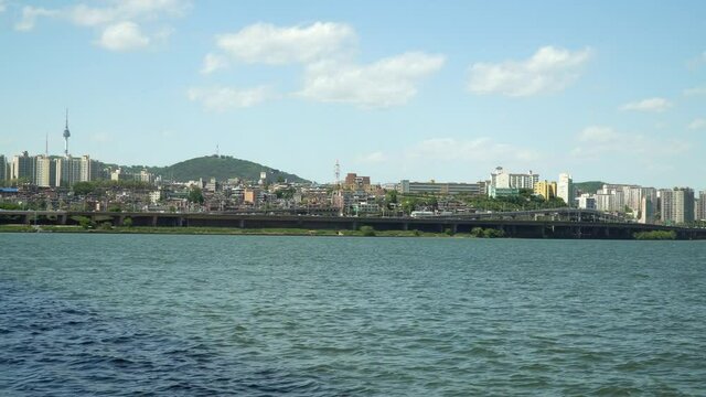 Cloudy Day in Seoul, Han river waterfront, Namsan tower and Yongsan District on Background, static, wide angle, 4k, copy space, template