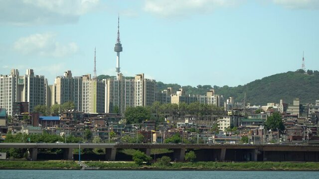 Namsan Tower over Yongsan district viewed from the bank of Han river iconic landmark of Seoul South Korea, also know as N Seoul Tower, YTN Seoul Tower or Seoul Tower